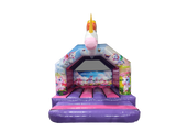 A children's inflatable bounce house with a unicorn design, featuring a purple base, pink steps, and a white unicorn head with a gold horn on the front.