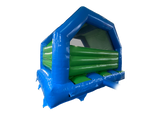 An inflatable bouncy castle with a blue exterior frame and green interior padding, shown on a plain white background.