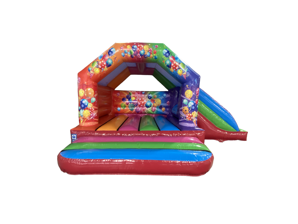 Airquee 6x4m multicoloured party bouncy castle with side slide, featuring bright balloon and streamer artwork.