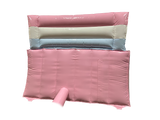 Airquee 1.5m pastel pink, white, and blue inflatable slide made of glossy, easy-to-clean PVC for children's parties.